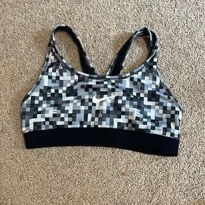 Black, grey, and white Nike sports bra